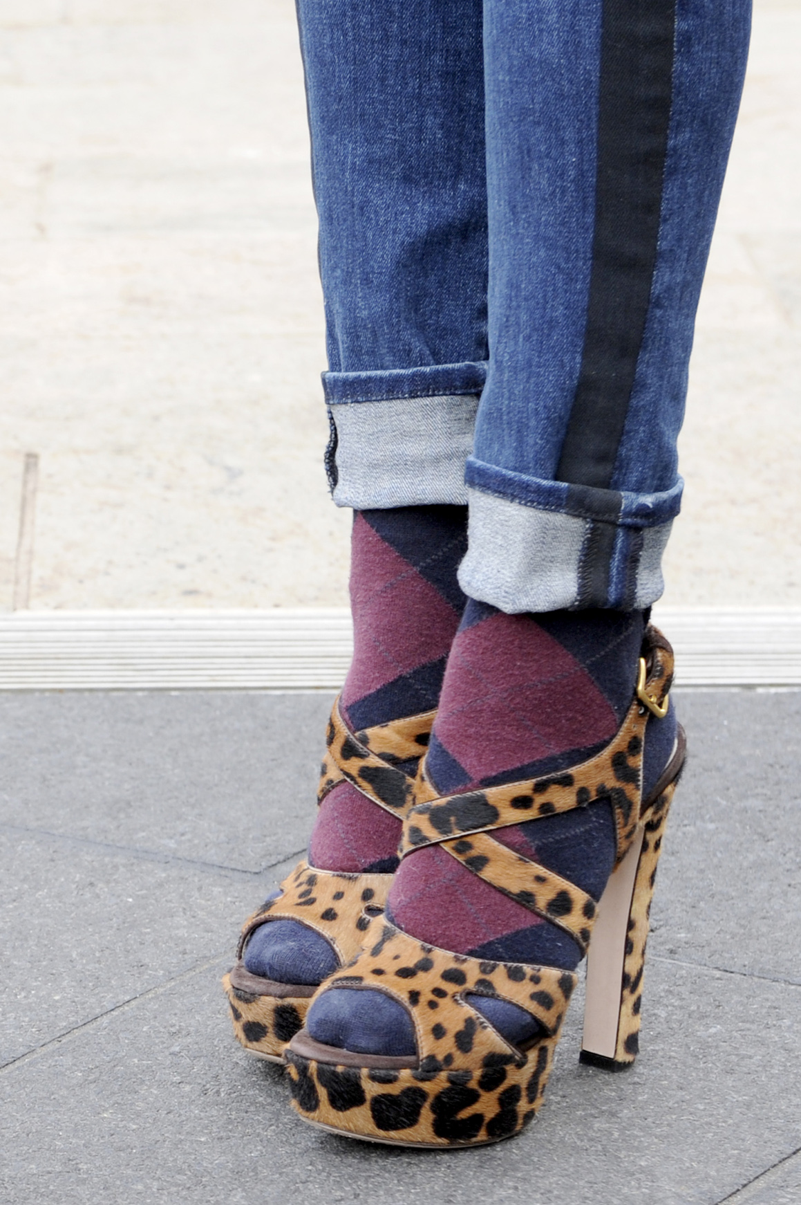 A fashion week attendee wears socks and sandals with style.