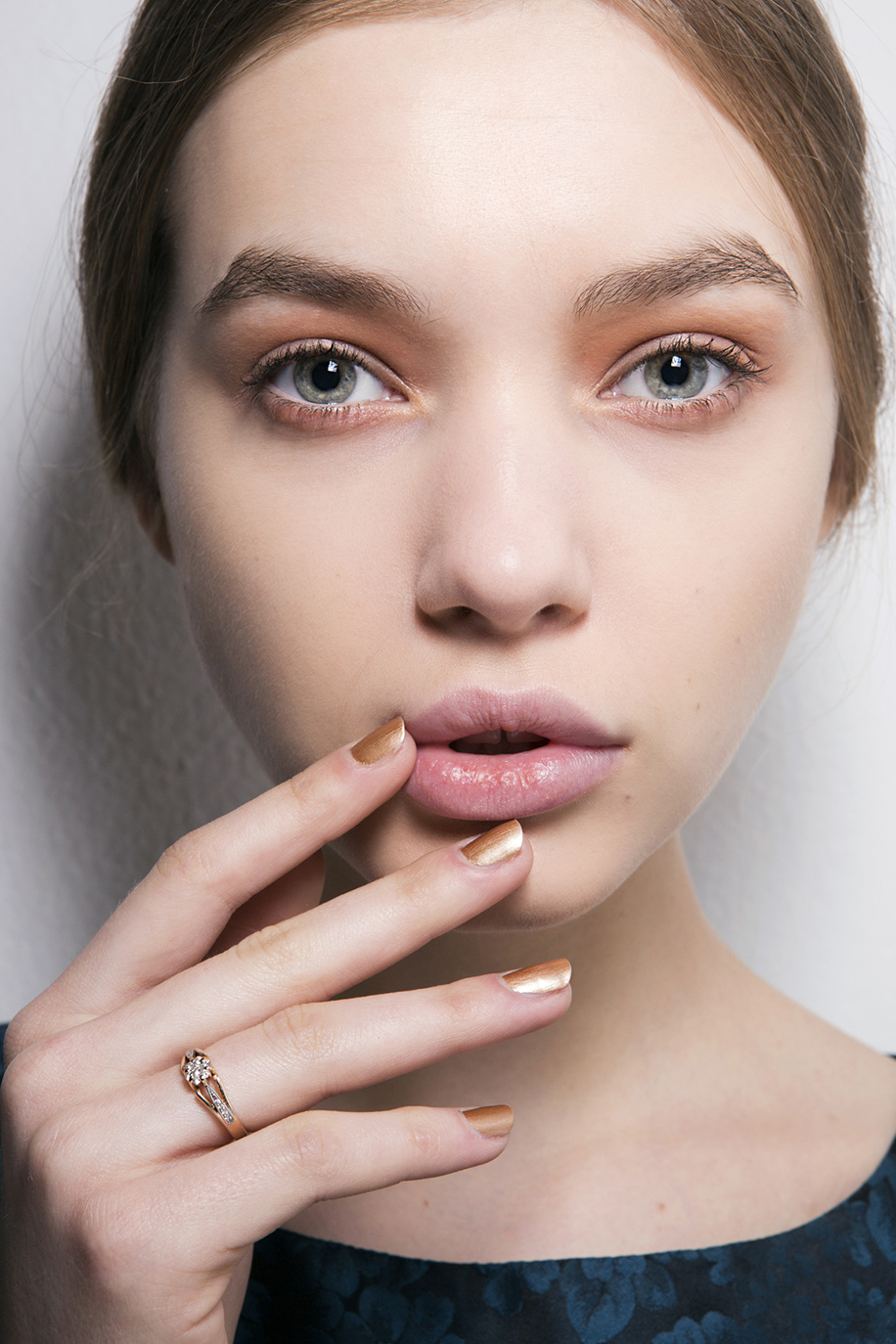 pretty model touching face