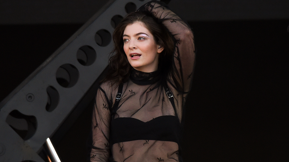 Lorde Style: Lorde wears bralet under sheer top in 2017.