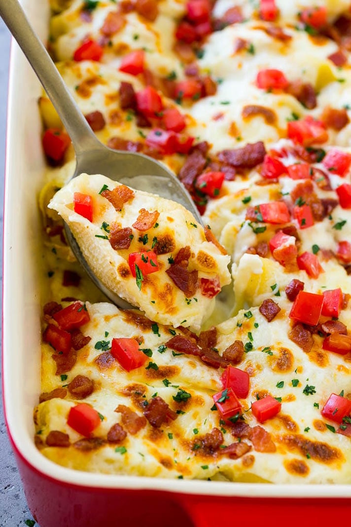 STYLECASTER | 17 Easy Baked Pasta Recipes That Are Cozy AF | Chicken Alfredo Stuffed Shells