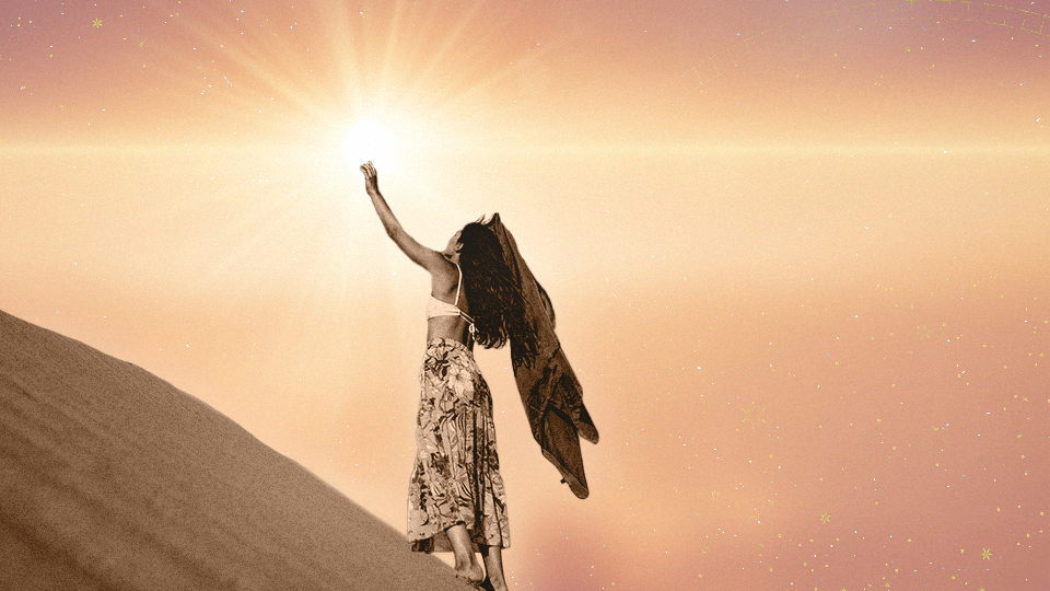 A woman reaching up toward the sun during August 2024, to celebrate the arrival of Leo season in her horoscopes