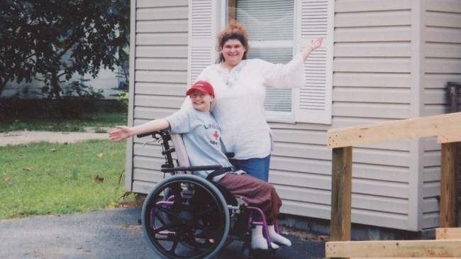 Wheelchair ridden, Gypsy Rose poses with her mother, whom she'd later murder for all the abuse she suffered at her hand