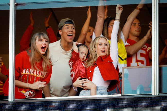 Taylor Swift, in a Chiefs sweatshirt and dainty jewelry, and Brittany Mahomes cheer during the Chiefs vs. Chargers game