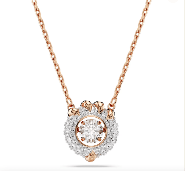 A Swarovski rose gold necklace with a dragon pendant