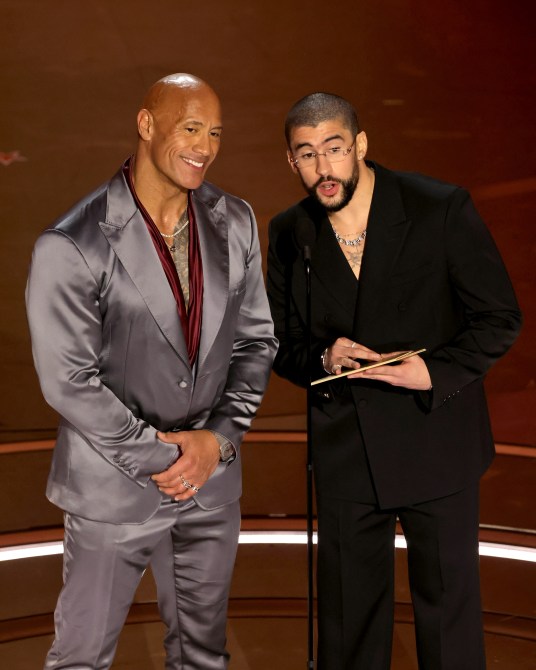 Dwayne Johnson and Bad Bunny speak onstage during the 96th Annual Academy Awards at Dolby Theatre on March 10, 2024 in Hollywood, California