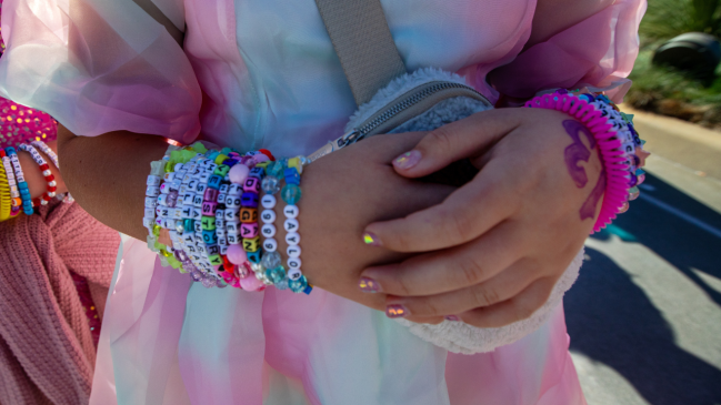 Swiftie wearing friendship bracelets at Eras Tour