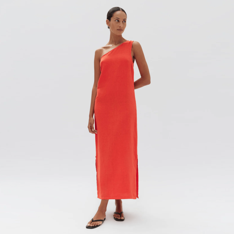 A model wearing a one-shoulder red linen dress