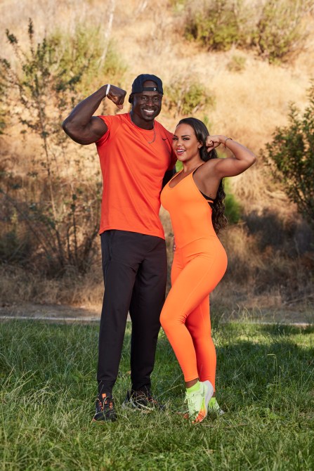 Rod Gardner, a Black man wearing a baseball cap & Leticia Gardner a  woman wearing matching orange athletic wear