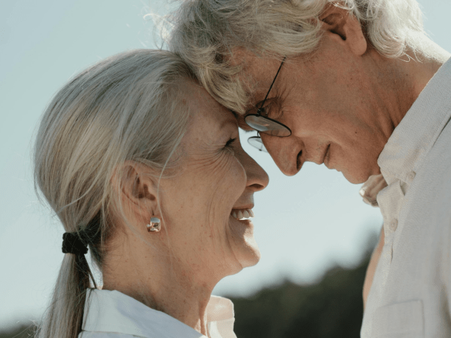 This older couple shares a loving look in a close up picture