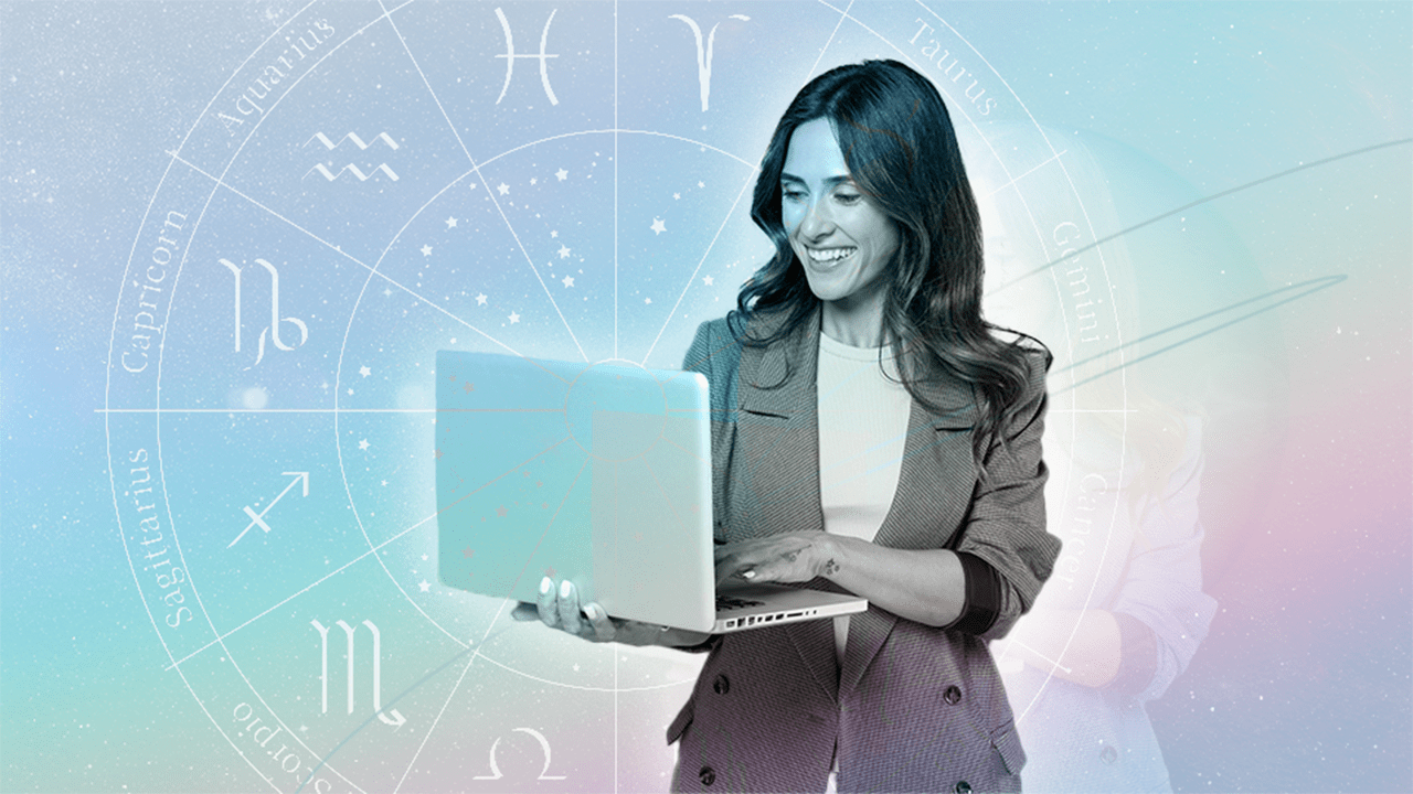 A woman looking at her computer, doing research on the careers her zodiac sign would thrive in.