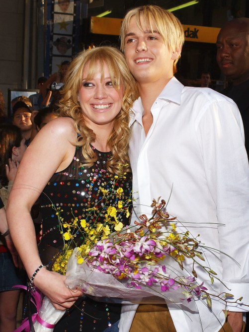 Actress Hilary Duff (L) hugs singer Aaron Carter as they attend the premiere of The Lizzie McGuire Movie on April 26, 2003 in Hollywood, California.