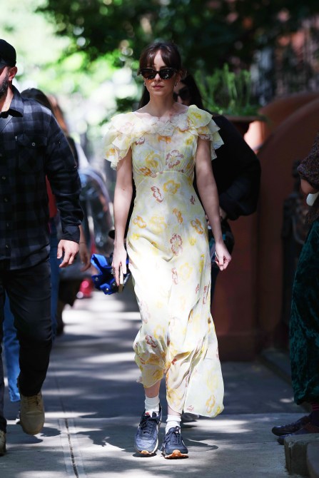 Dakota Johnson wearing cat eye sunglasses.