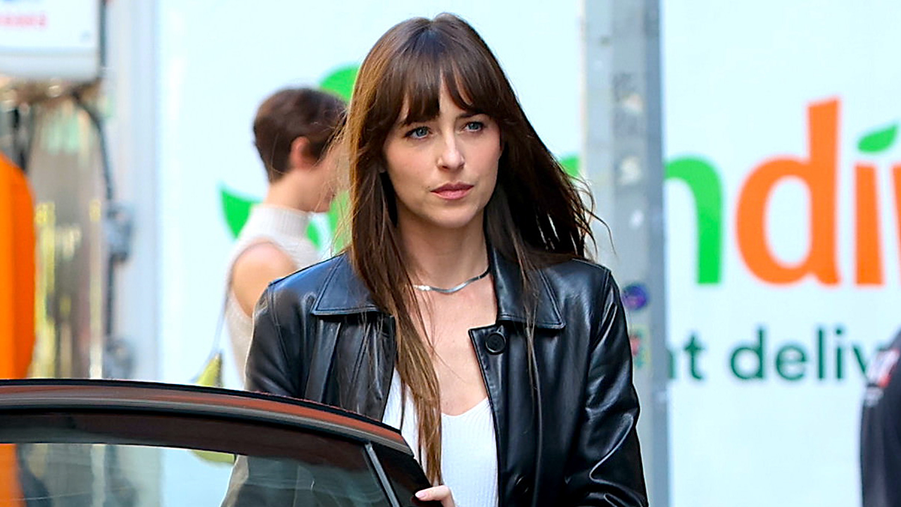 Dakota Johnson on the set of Materialists wearing a leather jacket.