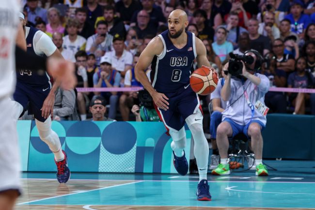 Derrick White #8 of Team USA dribbles the ball during the Men's Group Phase - Group C match between Serbia and USA on Day 2 of the Olympic Games Paris 2024 at Stade Pierre Mauroy on July 28, 2024 in Lille, France.