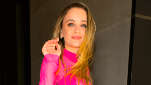 Joey King in a hot pink sheer top.