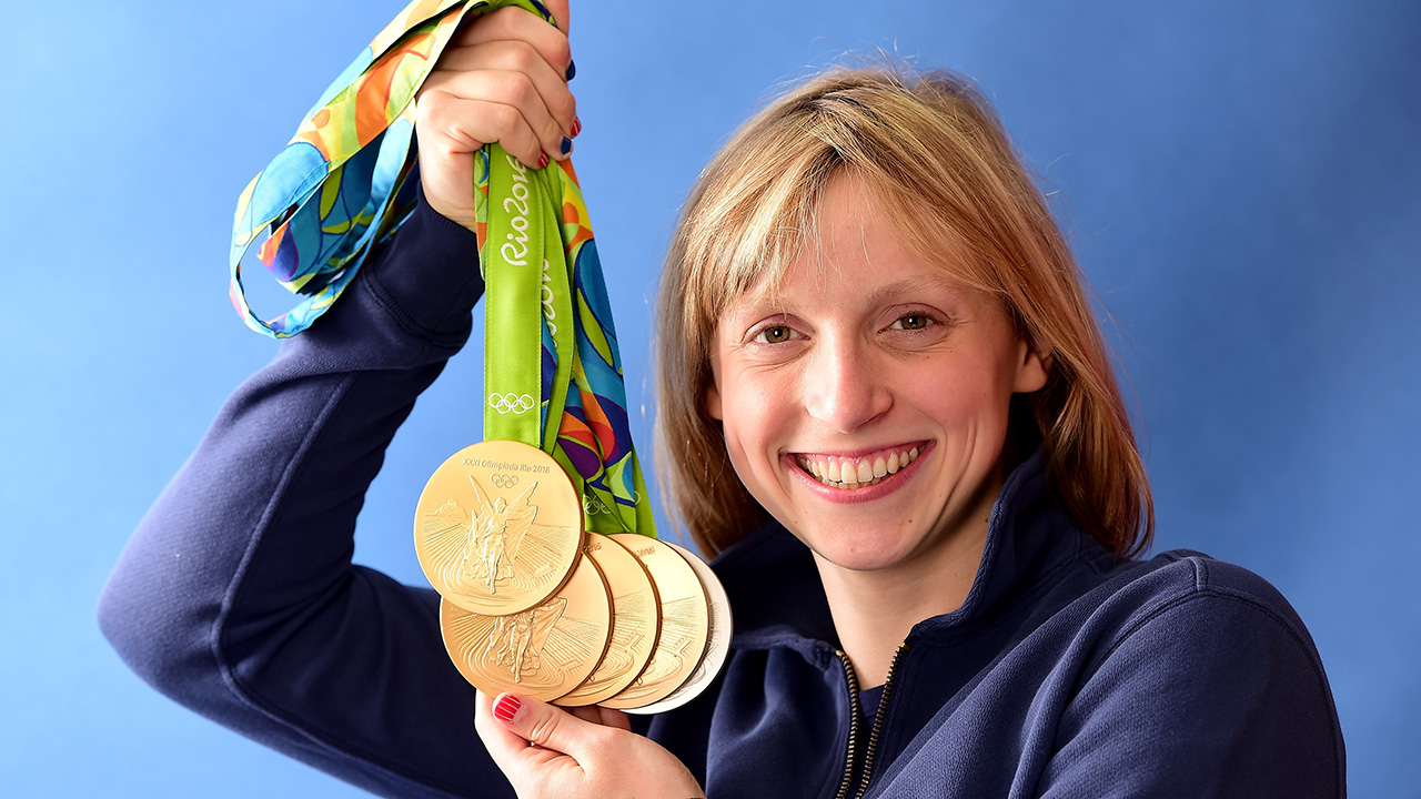 RIO DE JANEIRO, BRAZIL - AUGUST 13: (BROADCAST - OUT) Swimmer, Katie Ledecky of the United States poses for a photo with her five medals on the Today show set on Copacabana Beach on August 13, 2016 in Rio de Janeiro, Brazil