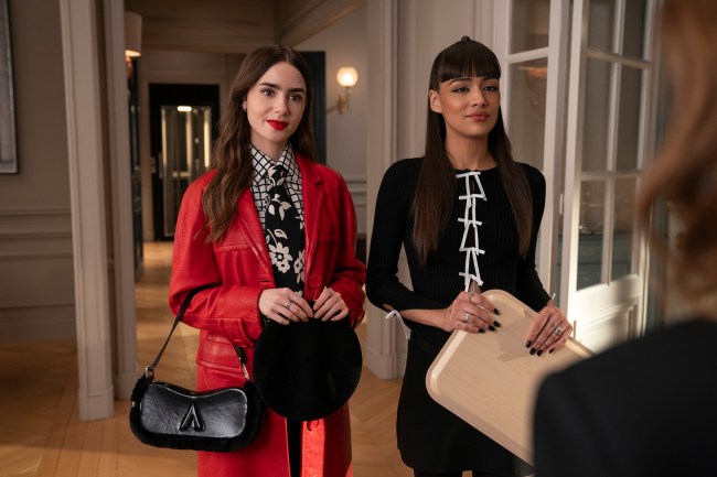 Emily in Paris. (L to R) Lily Collins as Emily, Thalia Besson as Genevieve in Emily in Paris.