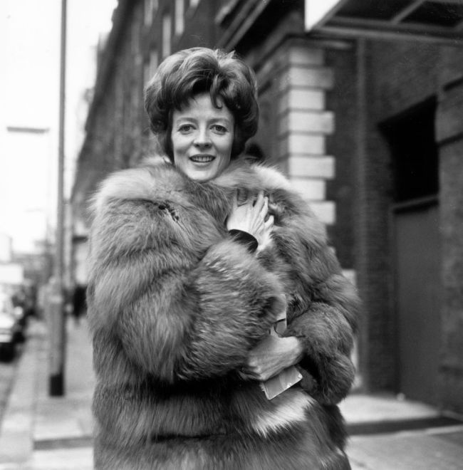 Maggie Smith, British actress, wearing a fur coat as she poses for a portrait, in January 1969.