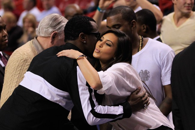 MIAMI, FL - DECEMBER 06: Sean P. Diddy Combs (L) greets Kim Kardashian and Kanye West prior to the game between the New York Knicks and Miami Heat at American Airlines Arena on December 6, 2012 in Miami, Florida. NOTE TO USER: User expressly acknowledges and agrees that, by downloading and or using this photograph, User is consenting to the terms and conditions of the Getty Images License Agreement.