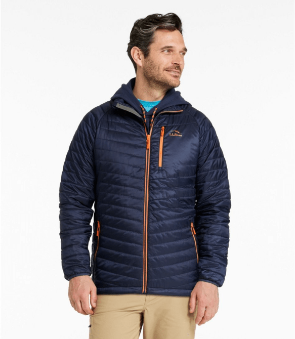 A model wearing the L.L.Bean Men's PrimaLoft Packaway Jacket in dark blue and orange
