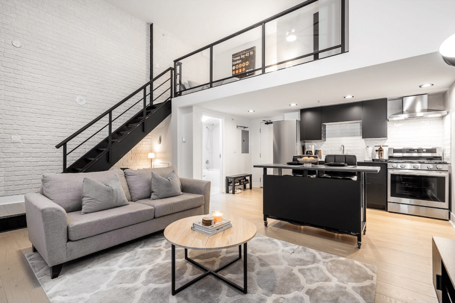 A modern apartment living room and kitchen and loft. A downtown Vancouver Airbnb.