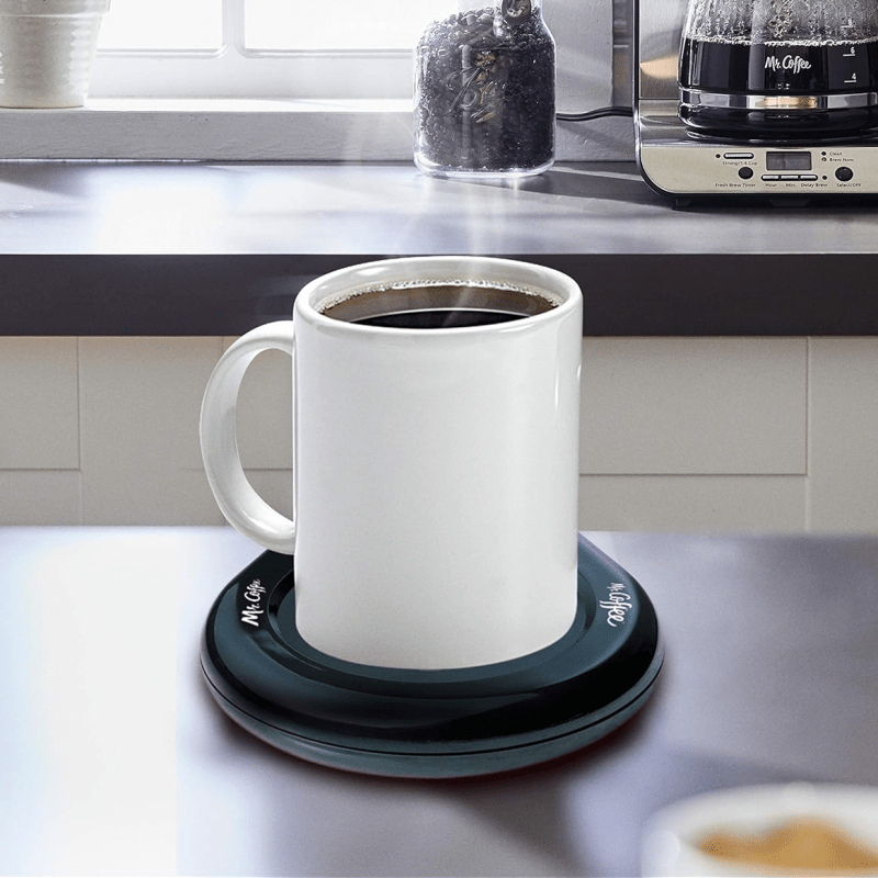 Mr. Coffee Mug Warmer with a mug on it in a kitchen