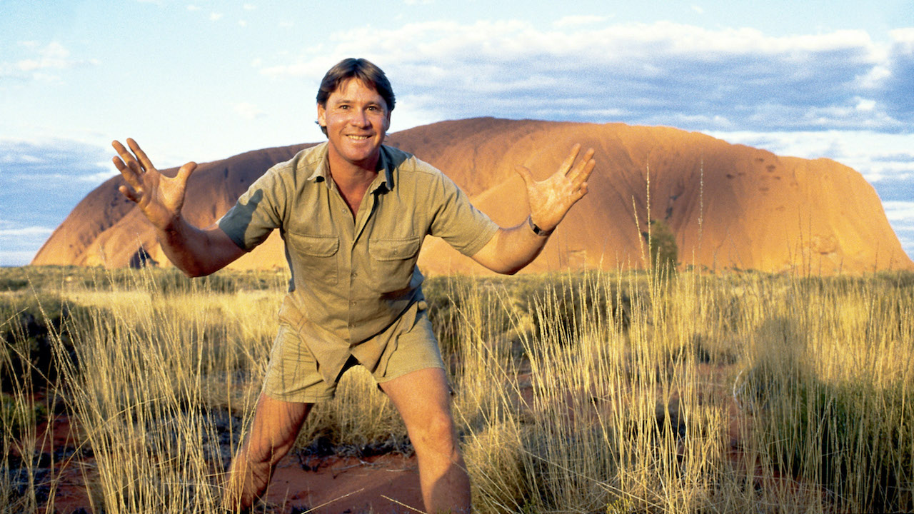 Steve Irwin on Animal Planet, which viewers can find out how to watch for free without cable. The Crocodile Hunter appears in his signature khaki shirt during his early 2000s wildlife series, Crocodile Hunter.