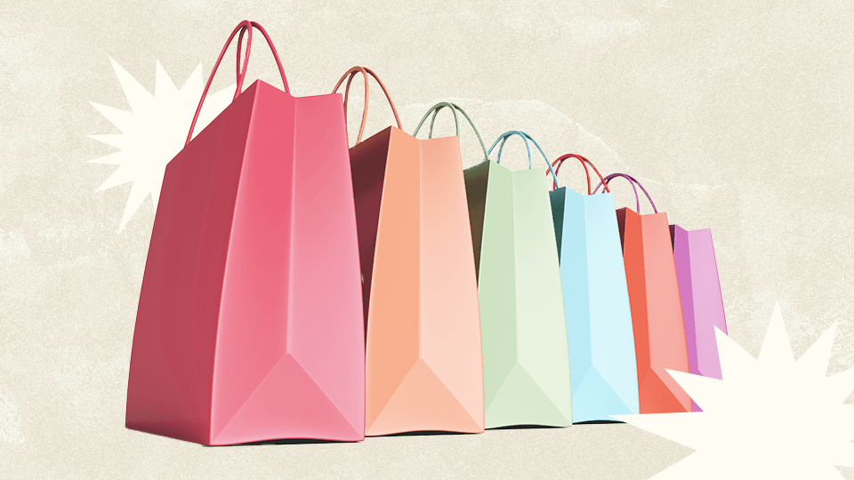 Six colorful shopping bags lined up