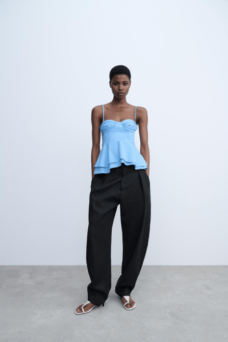 A model wearing the Zara ZW Collection Bustier Top in light blue