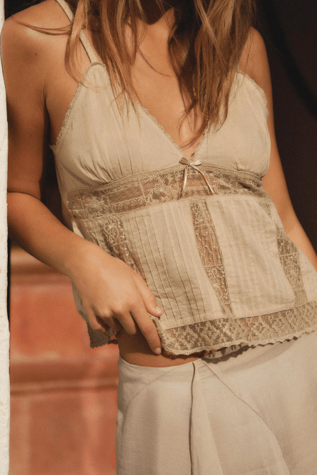 A model wearing the Zara Embroidered Top in beige