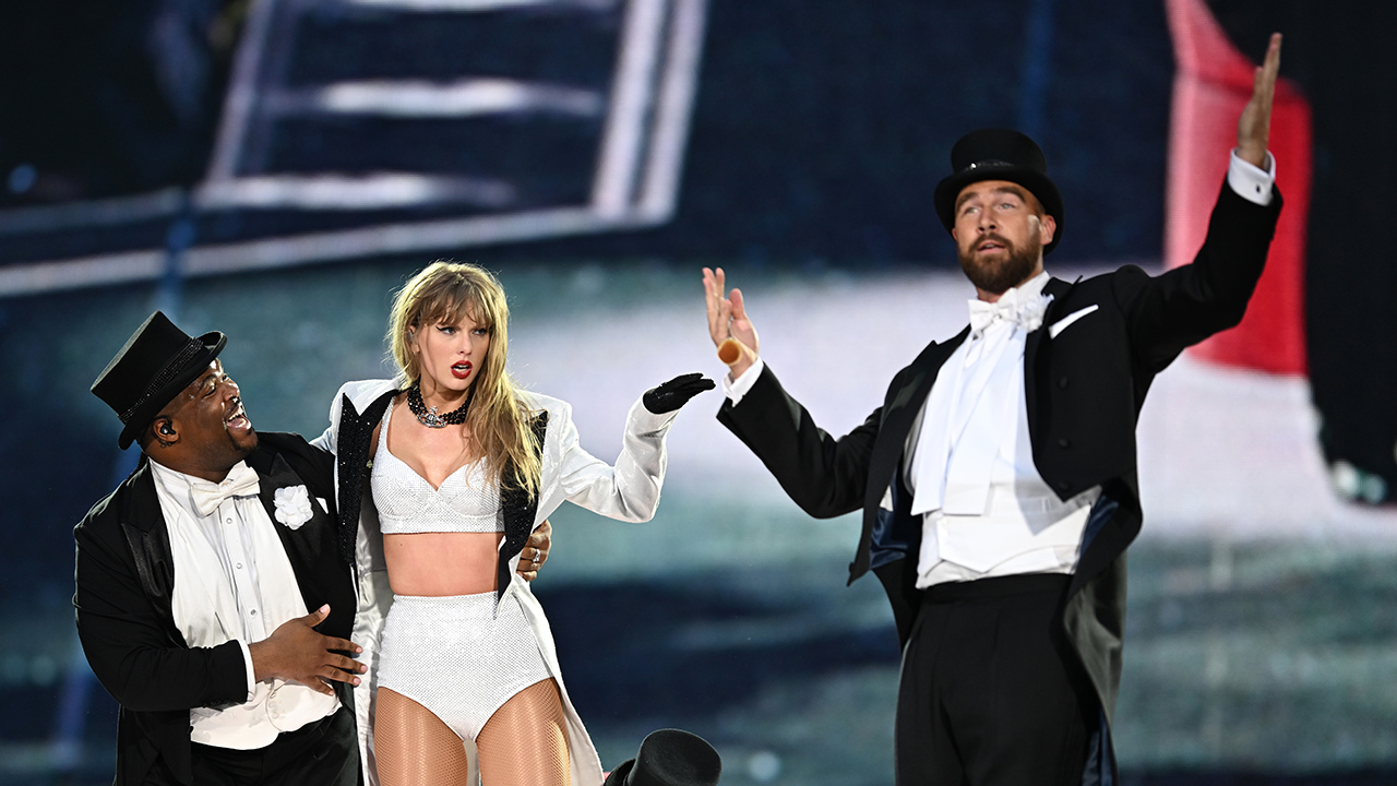 LONDON, ENGLAND - JUNE 23: (EDITORIAL USE ONLY. NO STANDALONE PUBLICATION USE (NO SPECIAL INTEREST OR SINGLE ARTIST PUBLICATION USE; NO BOOK USE)) EXCLUSIVE ACCESS. Taylor Swift is joined on stage by Travis Kelce (R), during "Taylor Swift | The Eras Tour" at Wembley Stadium on June 23, 2024 in London, England.