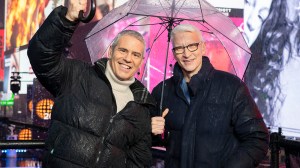 NEW YORK, NEW YORK - DECEMBER 31: Andy Cohen and Anderson Cooper host CNN's New Year's Eve coverage in the rain in Times Square on December 31, 2024 in New York City.