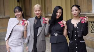 LONDON, ENGLAND - NOVEMBER 22: (left to right) Lisa (Lalisa Manoban), Rose (Roseanne Park), Jisoo Kim and Jennie Kim, from the K-Pop band Blackpink pose with their Honorary MBEs (Members of the Order of the British Empire), awarded to them in recognition of the band's role as COP26 advocates for the COP26 Summit in Glasgow 2021 on November 22, 2023 in London, England. King Charles III conducted the special Investiture ceremony in the presence of the President of South Korea, Yoon Suk Yeol, and his wife, Kim Keon Hee. (Photo by Victoria Jones - Pool/Getty Images)
