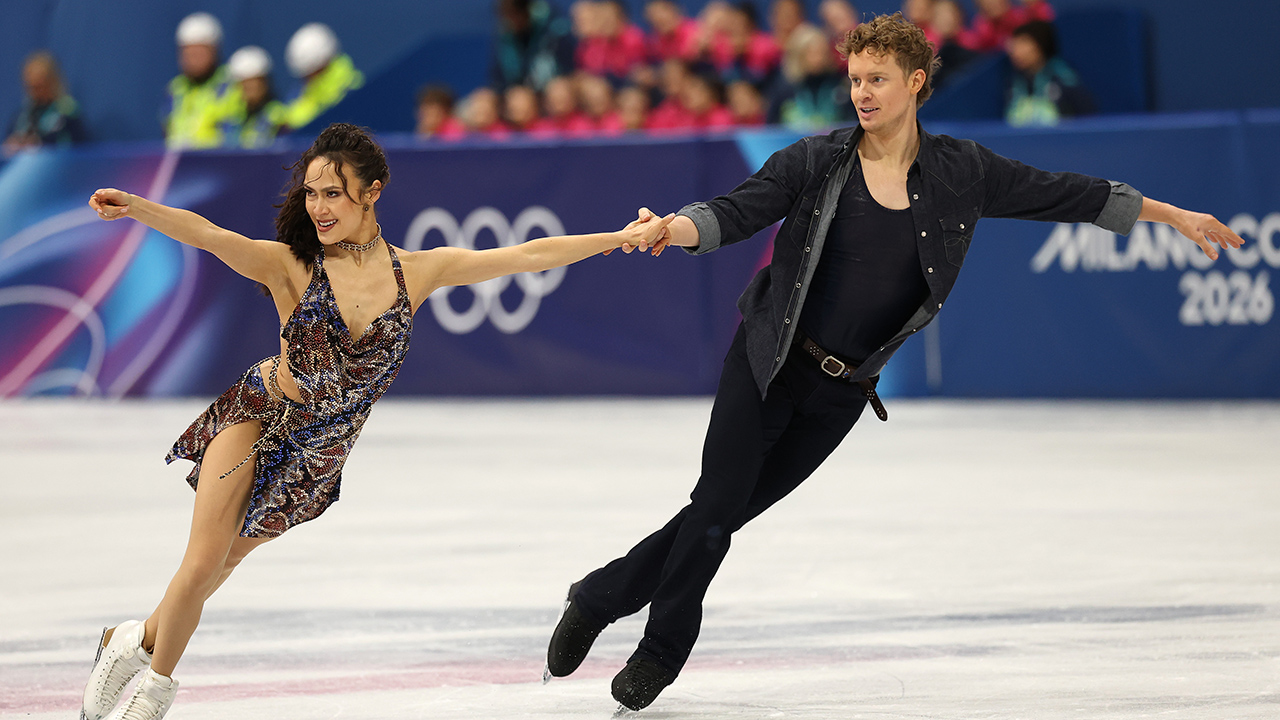 MILAN, ITALY - FEBRUARY 06: Madison Chock and partner Evan Bates of Team United States compete in the Ice Dance - Rhythm Dance on day zero of the Milano Cortina 2026 Winter Olympic games at Milano Ice Skating Arena on February 06, 2026 in Milan, Italy.